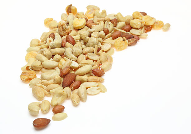 istock Various kind of nuts in a white background 497027942
