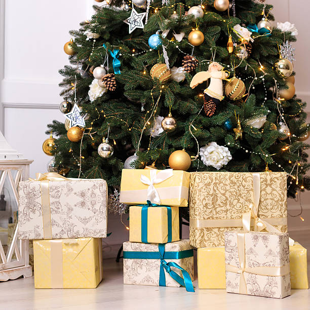 istock Many boxes with a christas gifts near the tree 497028970