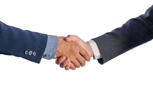istock Two Asian businessmen shake hands. 497029172