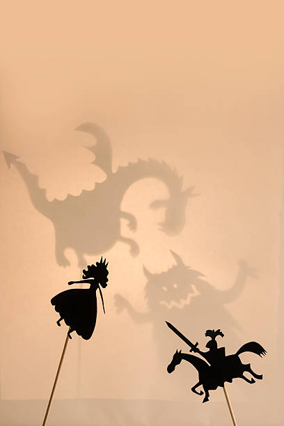 istock Shadow puppets of Princess and Knight, copy space background. 497029220