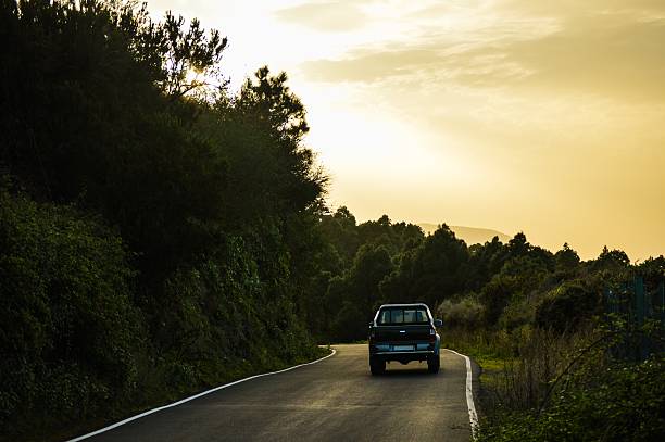 istock Car climbing the hills by dusk 497029802