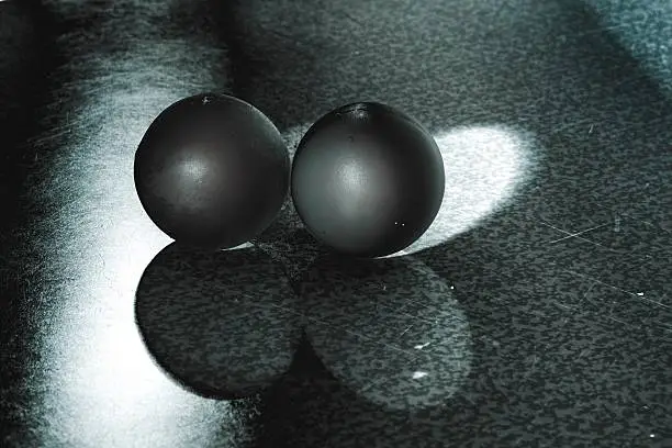 Photo of two balls in the dark