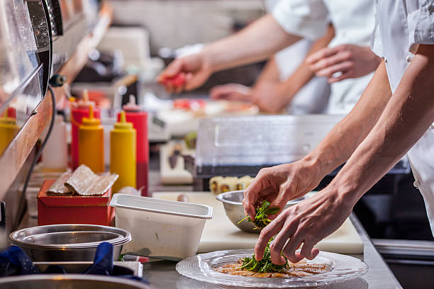 istock male cooks preparing meals 497034178