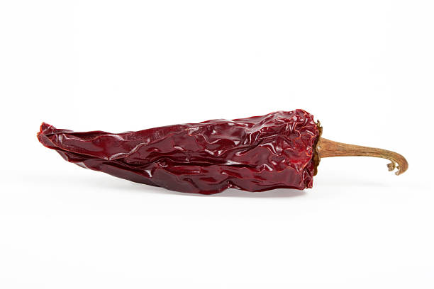 istock Red dried chilli pepper isolated on white background 497034756