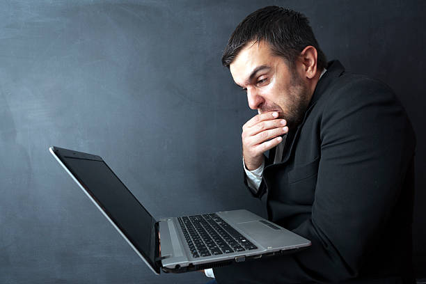 istock Thinking Businessman With Laptop 497034840