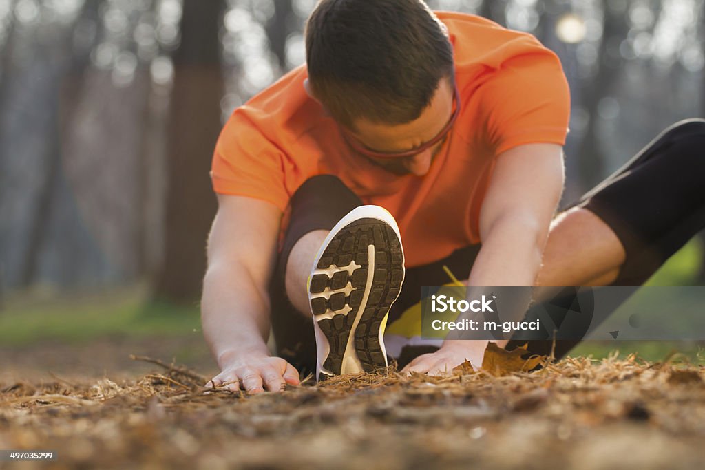Stretching after Jogging 30-39 Years Stock Photo