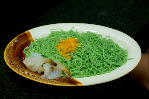 Green noodles on plate.Green noodles on plate.
