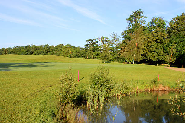 istock Image of pond at landscaped golf course, natural water hazard 497036737