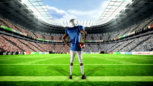 American football player triumphing with raised arms