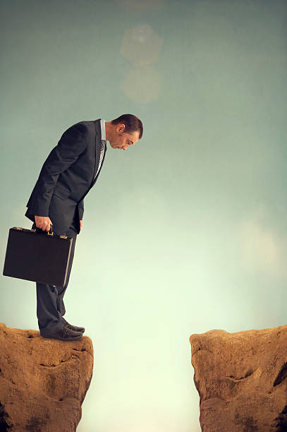 istock businessman on the edge 497037051