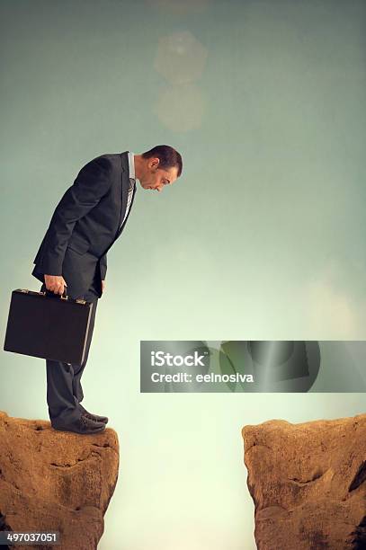 Businessman On The Edge Stock Photo - Download Image Now - At The Edge Of, Cliff, Corporate Business