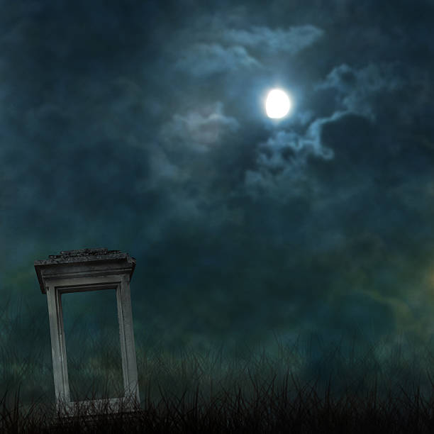 istock Spooky Halloween graveyard with dark clouds and ominous moon 497037737