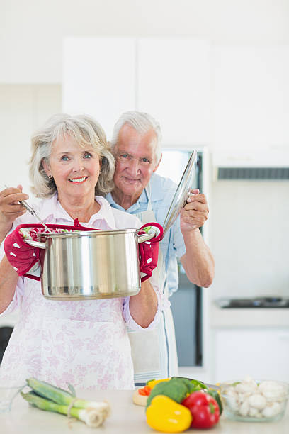 istock Senior couple preparing food in the kitchen 497037825