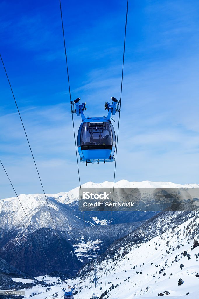 Front view of ski lift cable car Front view of ski lift cable car with valley and mountains on the background Activity Stock Photo