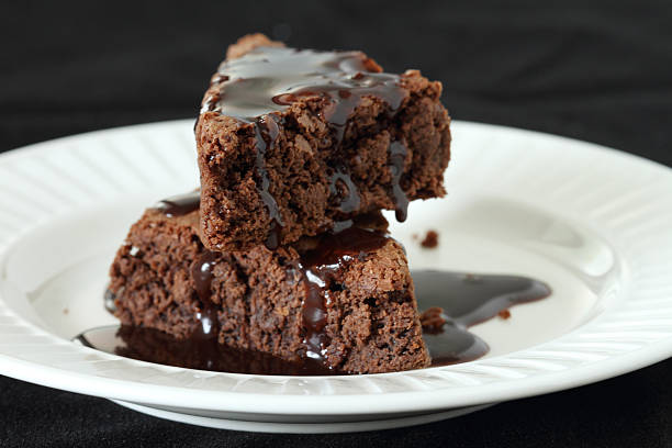 istock brownie on white plate covered with chocolate 497040225