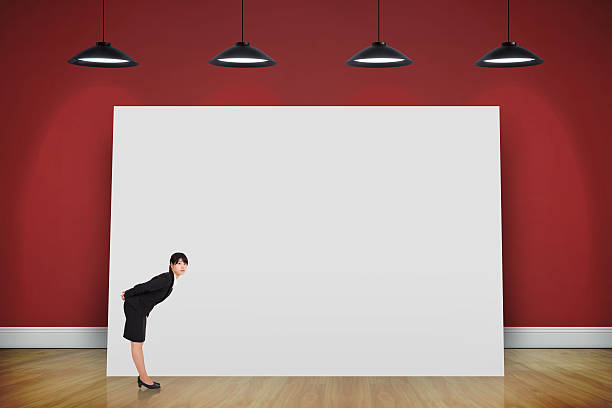 istock Composite image of serious businesswoman bending 497040689