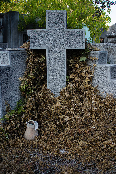 istock Religious cross tomb stone made of granite 497040737