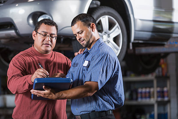 istock Customer at auto repair shop 497041257