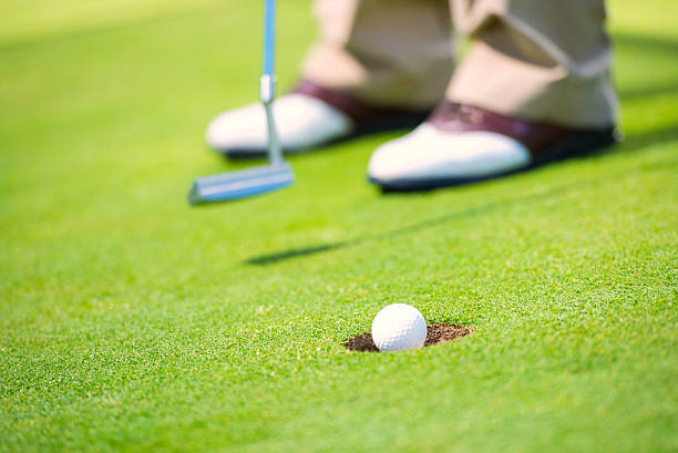 istock Close-up of Golfer Putting 497041499