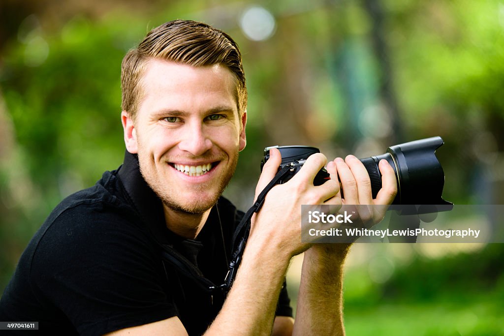Happy Photographer - Close Up A male holding a camera.  20-29 Years Stock Photo