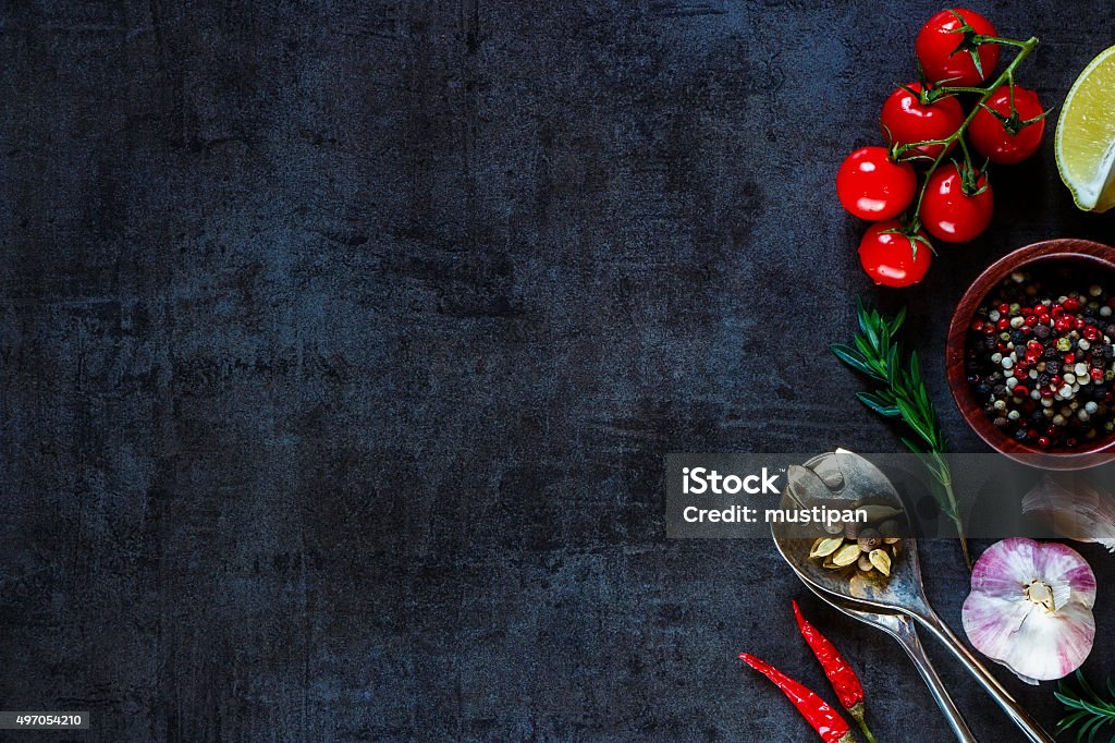 Organic vegetables for cooking Vintage spoon and vegetables for cooking on dark metal background with space for text. Top view. Bio Healthy food ingredients. 2015 Stock Photo