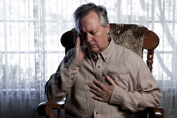 Man Suffering with Chest and Head Pain