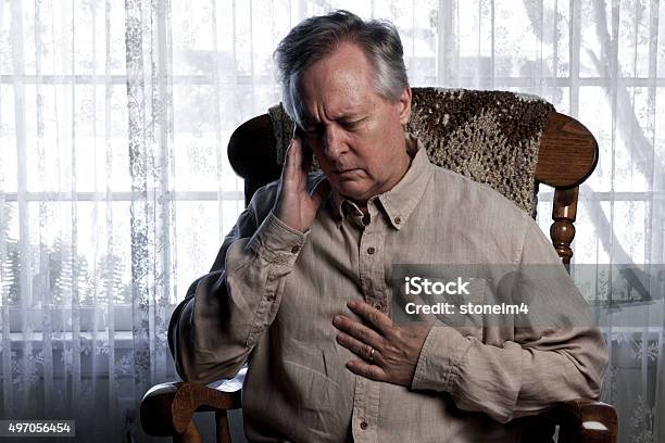 Man Suffering With Chest And Head Pain Stock Photo - Download Image Now - Cardiomyopathy, 2015, 60-69 Years