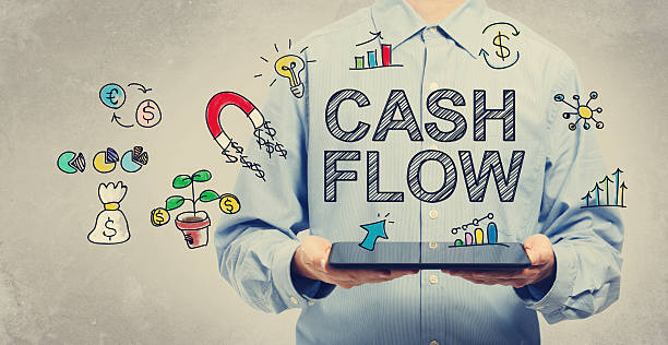 Cash Flow concept with young man holding a tablet stock photo
