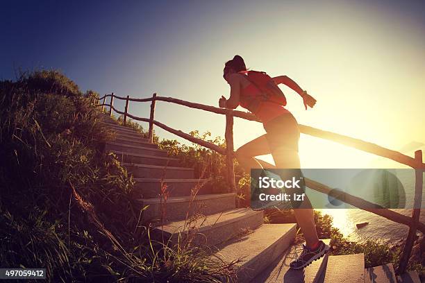 Fitness Woman Runner Trail Running On Seaside Mountain Stairs Stock Photo - Download Image Now