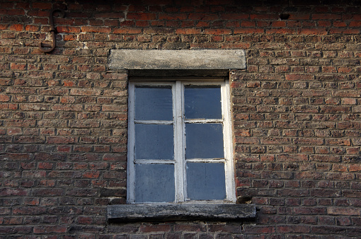 Old facade of a farm-house with window