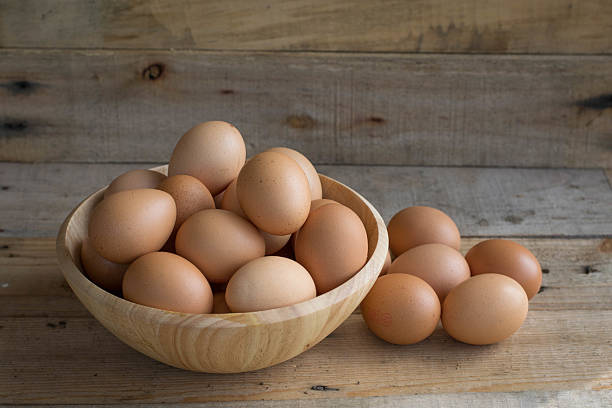 istock eggs in wooden bowls 497061690