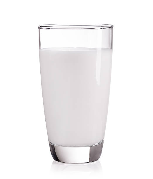 istock milk in the glass on white background 497063532
