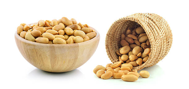 istock peanuts in the basket and wood bowl on white background 497067762
