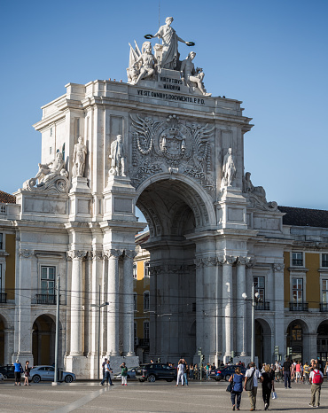 Lisbon, Portugal - September 26, 2015: Praça do Comércio with the tall equestrian statue of King José I (1714 - 1777) is the large, popular square in Lisbon. Surrounded by buildings and colonades with offices, bars and restaurants on three sides and the River Tejo (Tagus) on the fourth. The beautul triumphal arch,  Arco da Rua Augusta, is the main entrance to the square from Rua (street) Augusta.