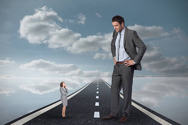 istock Composite image of smiling businessman with hands on hips lookin 497074459
