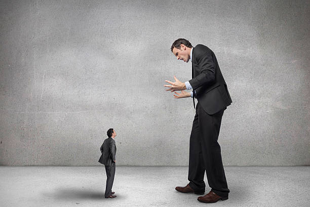 istock Composite image of stressed businessman gesturing at tiny busine 497074487