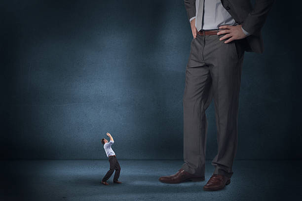 istock Composite image of businessman posing with arms up and giant 497074621