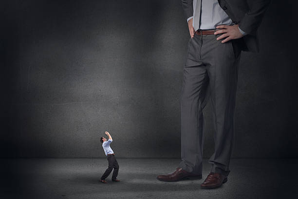 istock Composite image of businessman posing with arms up and giant 497074659