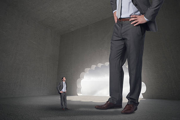 istock Composite image of serious businessman with hands on hips and 497074665
