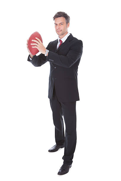 istock Businessman Holding Rugby Ball 497076941
