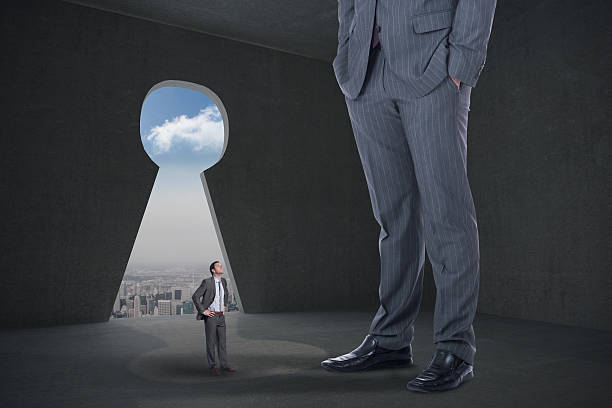 istock Composite image of serious businessman with hands on hips and 497078489