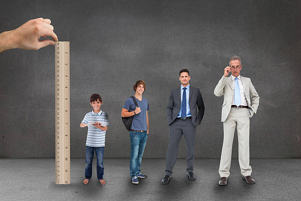 istock Hand measuring life stages of man with ruler 497078581