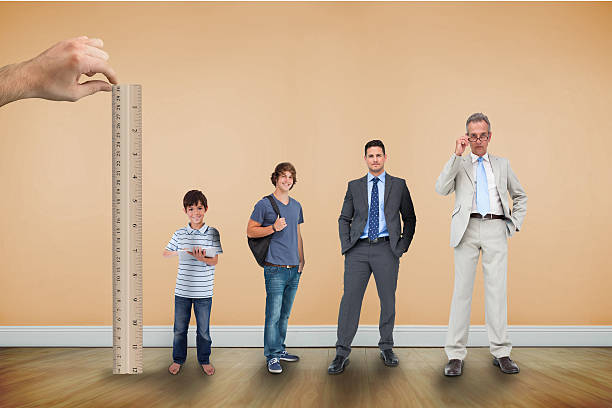 istock Hand measuring life stages of man with ruler 497078623