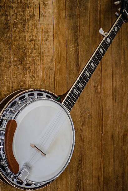 istock Five-string bluegrass banjo on distressed wooden planks. 497078979