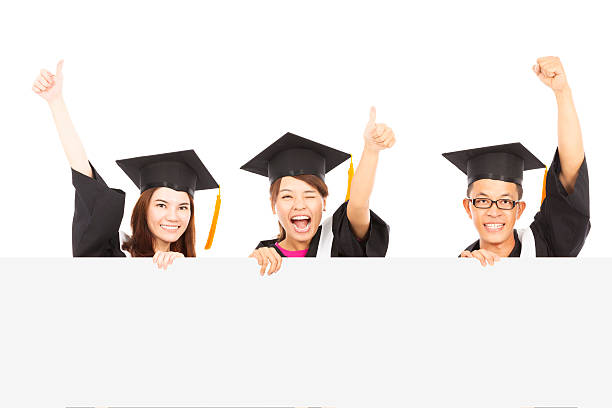istock cheerful young graduate students raise hands 497079625