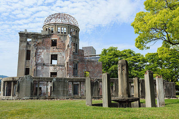 Atomic bomb dome memorial in Hiroshima, Japan he Atomic Bomb Dome memorial in Japan stands as a living reminder of the horrors of World War II. The Hiroshima A-Bomb Dome was the only building left standing in Hiroshima after the first nuclear detonation during World War II. air attack photos stock pictures, royalty-free photos & images
