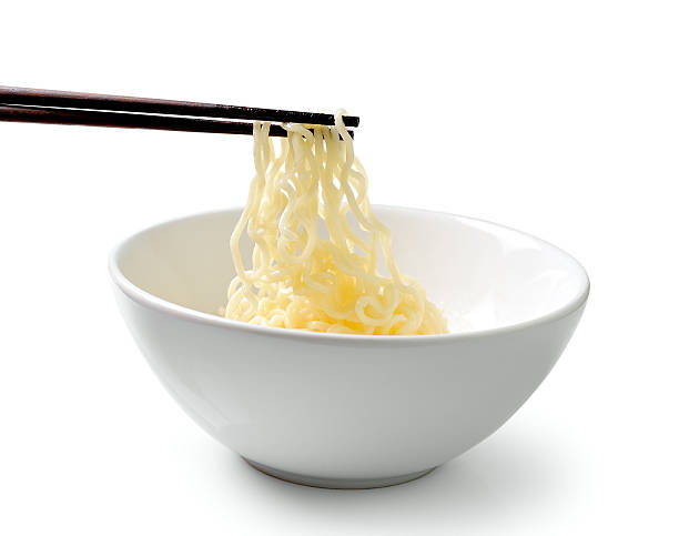 istock chopsticks holding  noodles isolated on white background 497080445