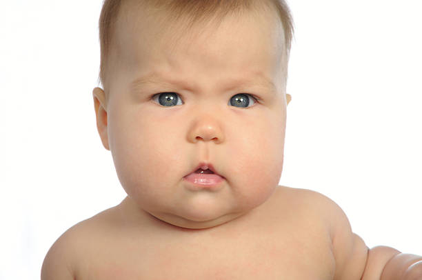 istock Baby looking serious isolated 497080829
