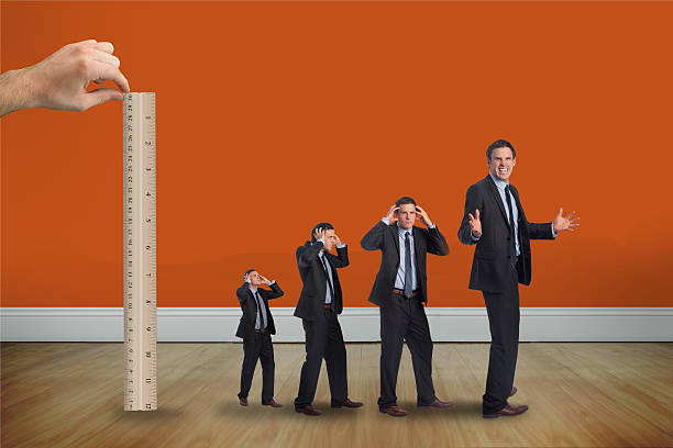 istock Composite image of hand measuring with ruler angry businessmen 497081549