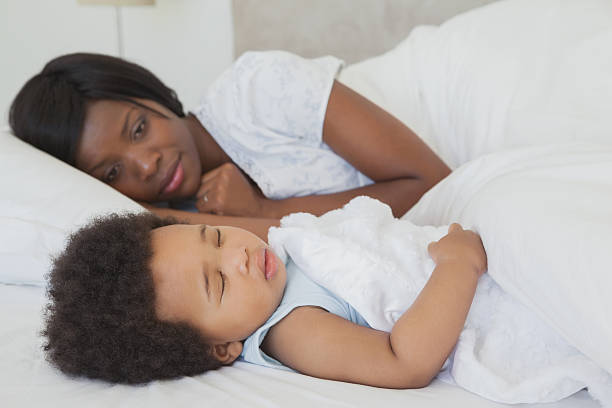 istock Mother watching little baby as he sleeps peacefully 497081597
